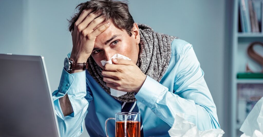 同僚の女性に体調悪いアピールをする男